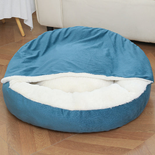 Teal blue hooded dog bed with plush lining on a living room floor