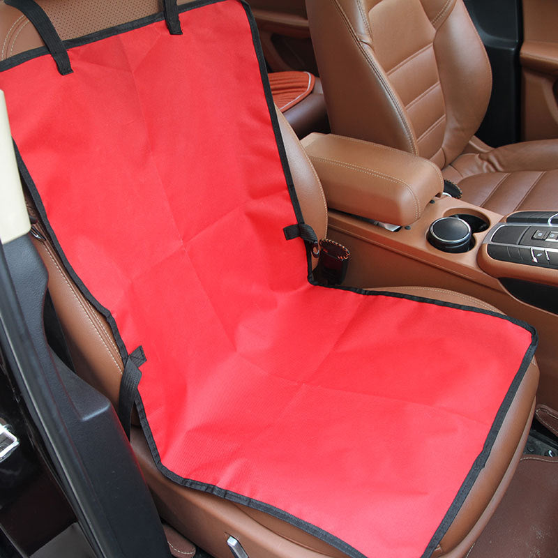Red dog car seat cover strapped over a car seat, side view