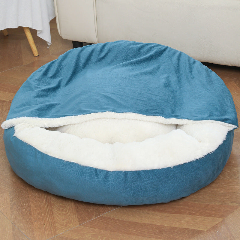 Teal blue hooded dog bed with plush lining on a living room floor