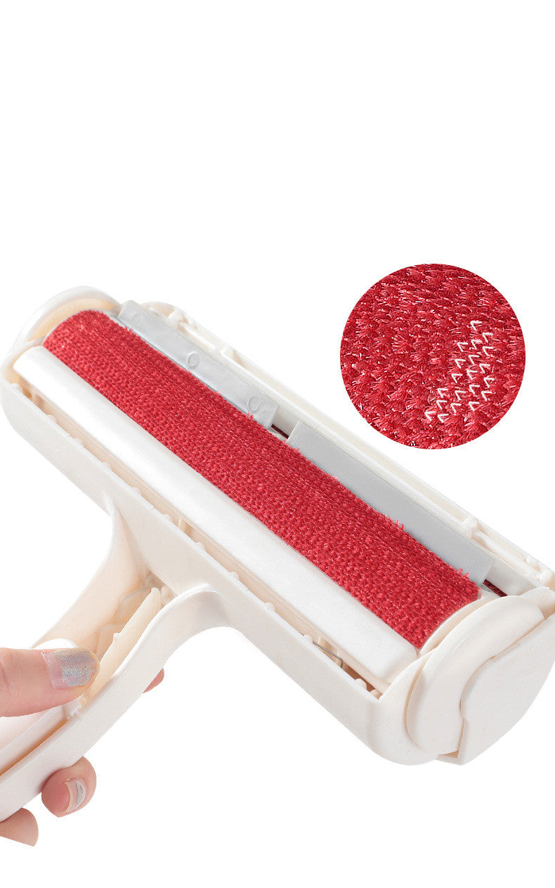 Hand holding the FurSweep pet hair roller, with a close-up of the red fabric texture