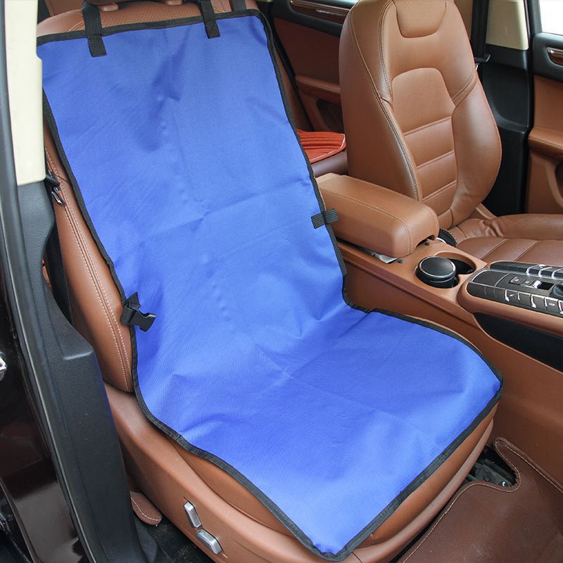 Blue dog car seat cover strapped to the headrest of a front car seat